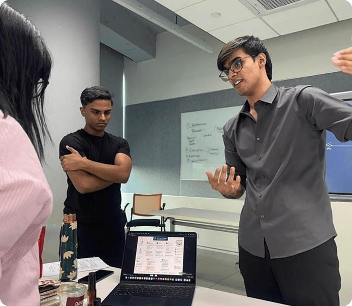 Founders reviewing a prototype at ATLAS Forge
